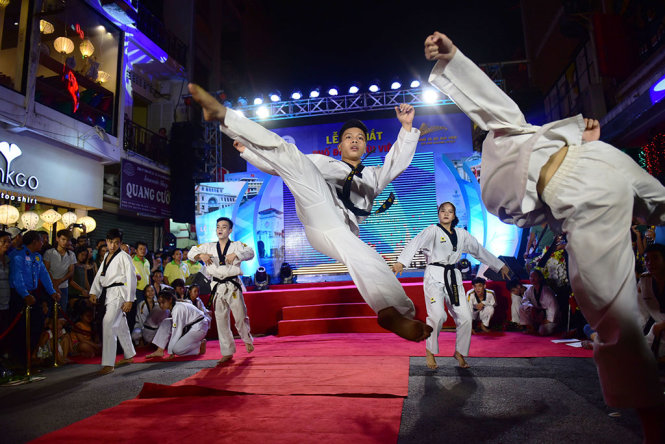 A team of martial artists is seen during performance
