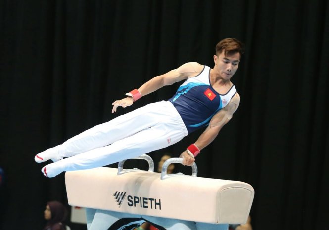 Vietnam's gymnast Pham Phuoc Hung performs during the men's artistic team event.