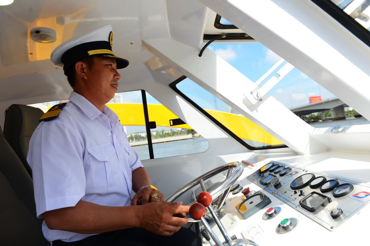 Captain Trinh Cong Son steers the water bus during its pilot phase on August 21, 2017.