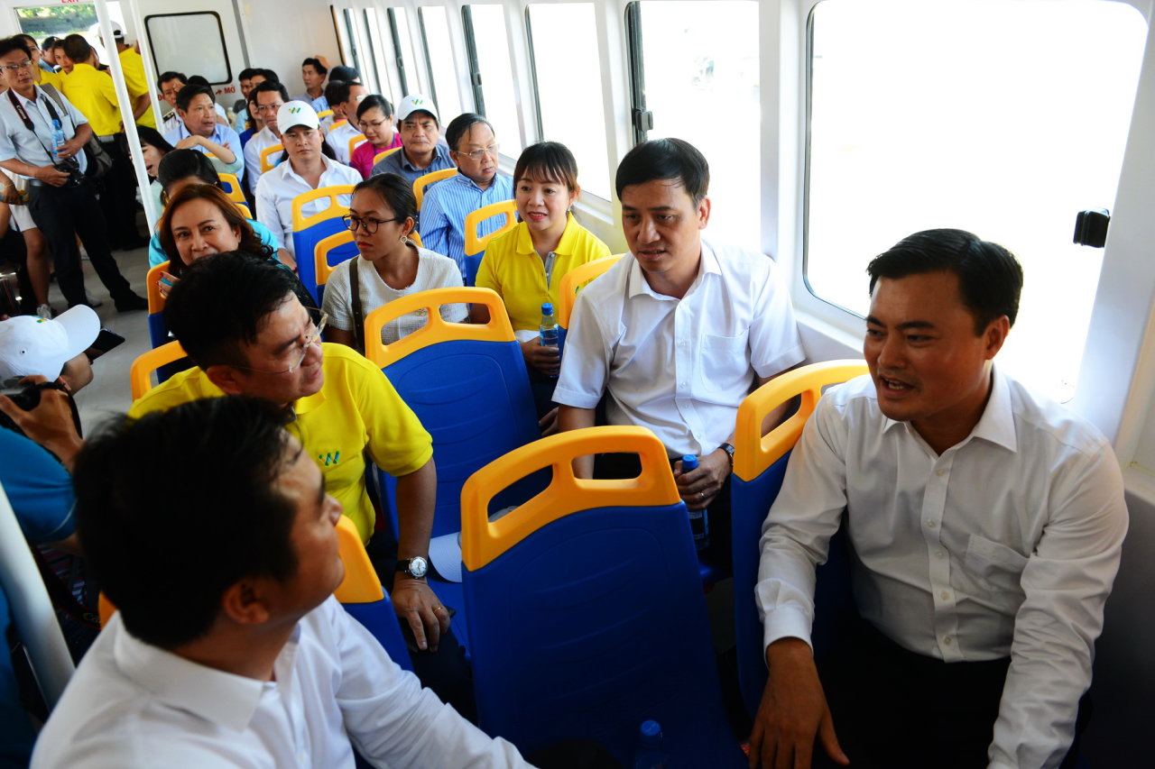 Ho Chi Minh City officials, media representatives and local residents are among the first passengers of the river bus.