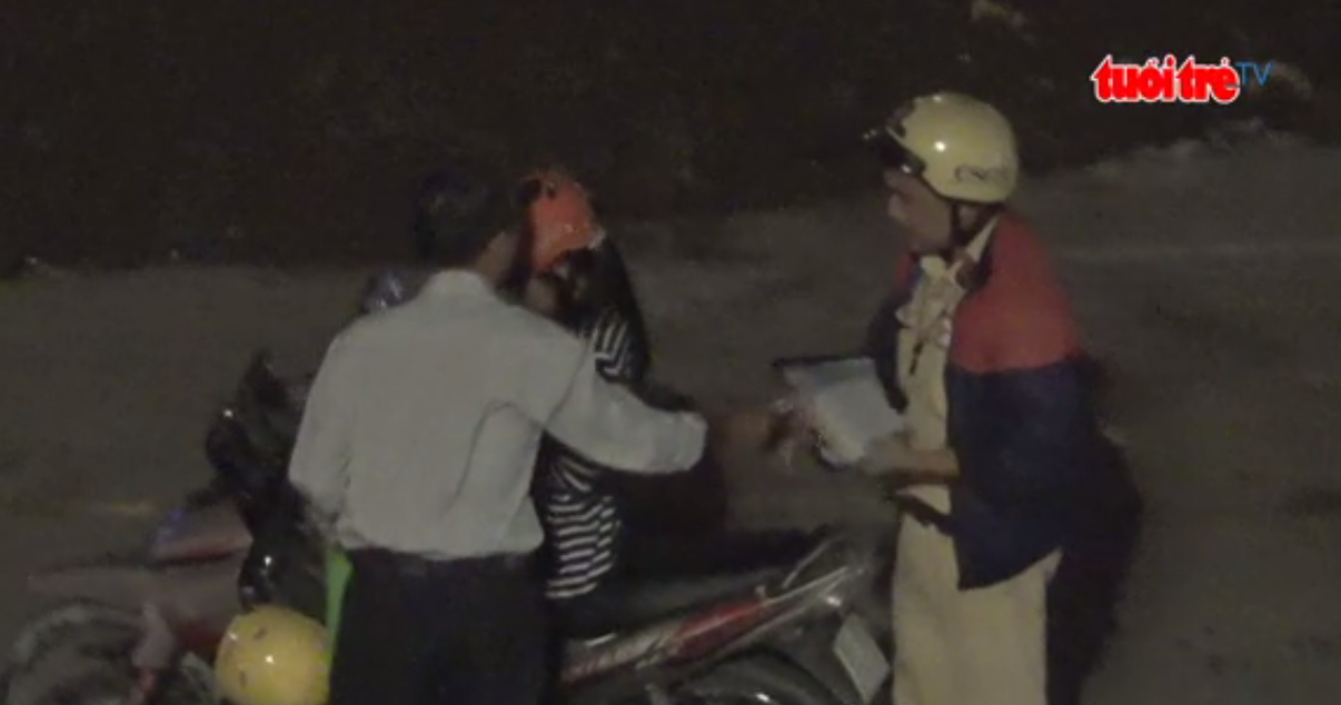 Traffic cops collect unofficial fines from commuters near Ho Chi Minh City airport
