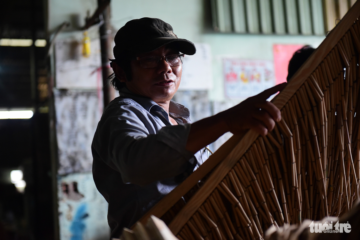 Nguyen Van Ben, owner of a bamboo curtain workshop in Tan Thong Hoi Commune, Cu Chi District, Ho Chi Minh City. Photo: Tuoi Tre