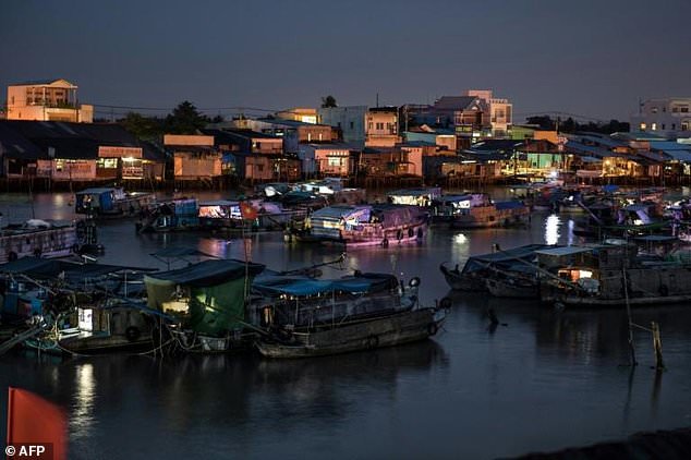 Boats lie anchored in a canal off the Hau River in the floating Cai Rang Market in Can Tho, a small city of the Mekong Delta. Photo: AFP