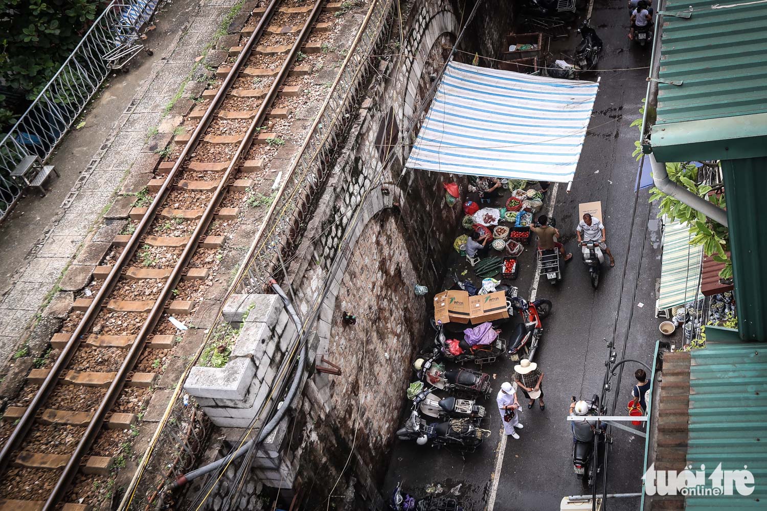Areas surrounding the elevated railway are often filled with business activities of local vendors.
