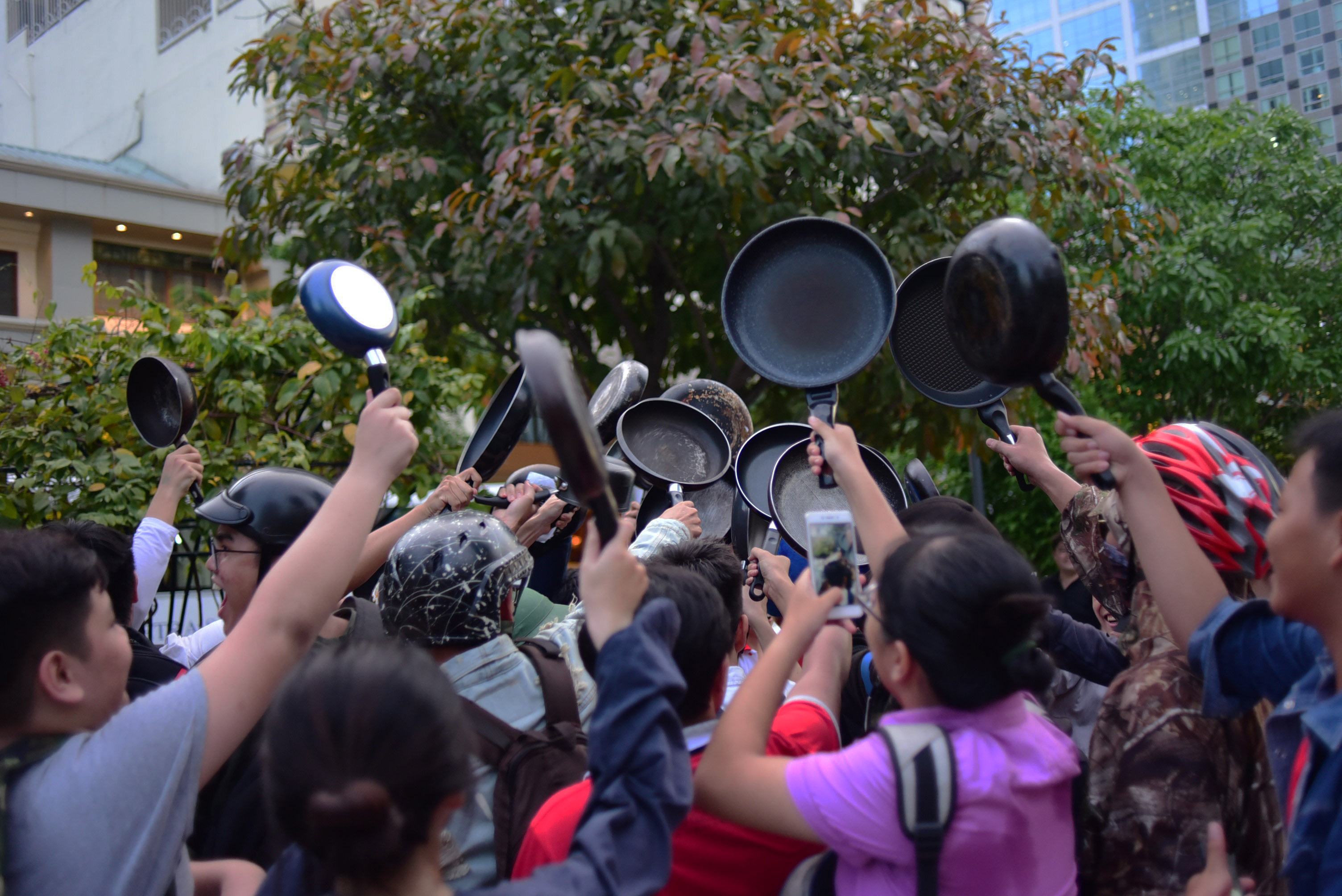 They cheer with the frying pans as part of multiple activities.