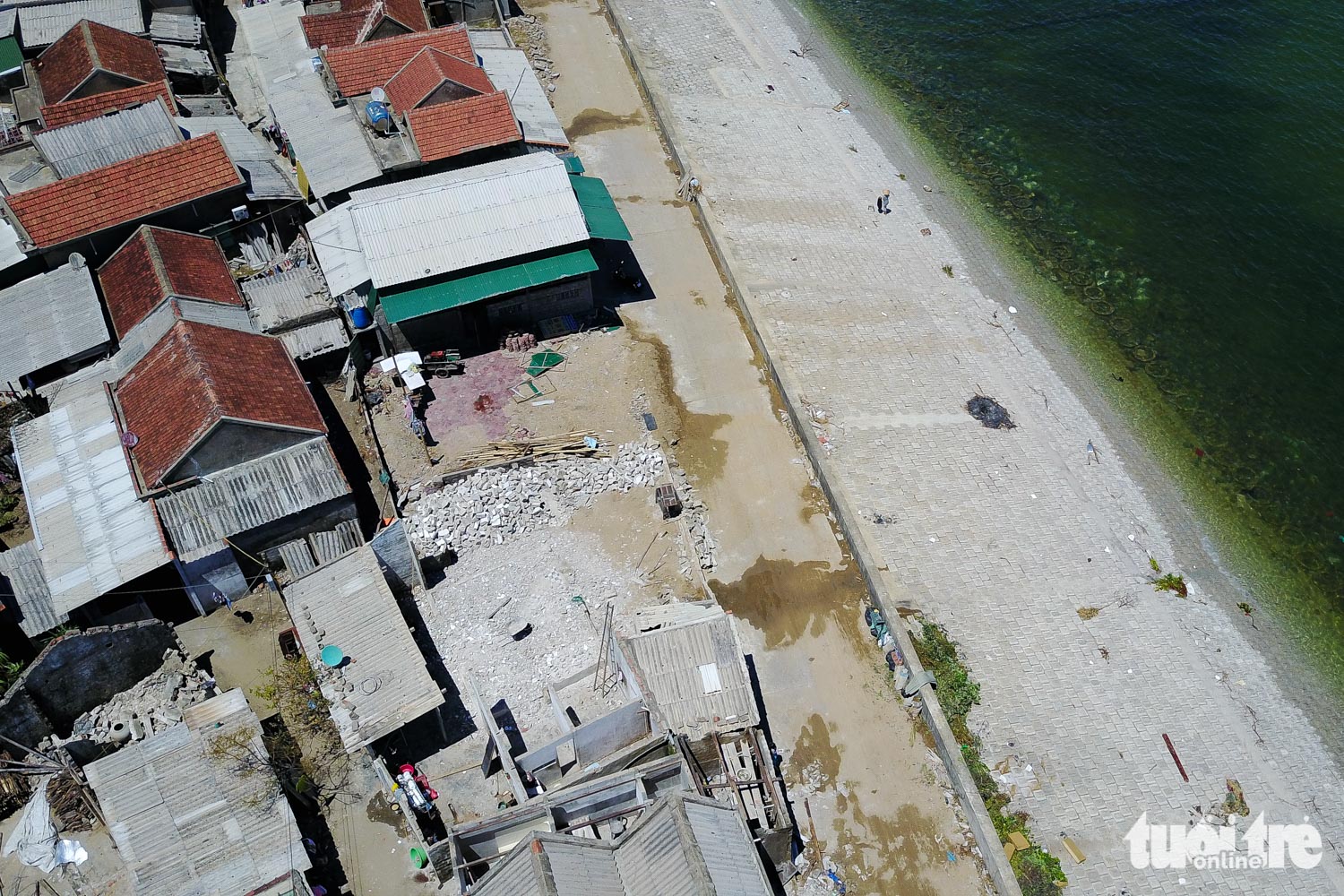 Houses are damaged after the storm in the coastal Cam Nhuong Commune.