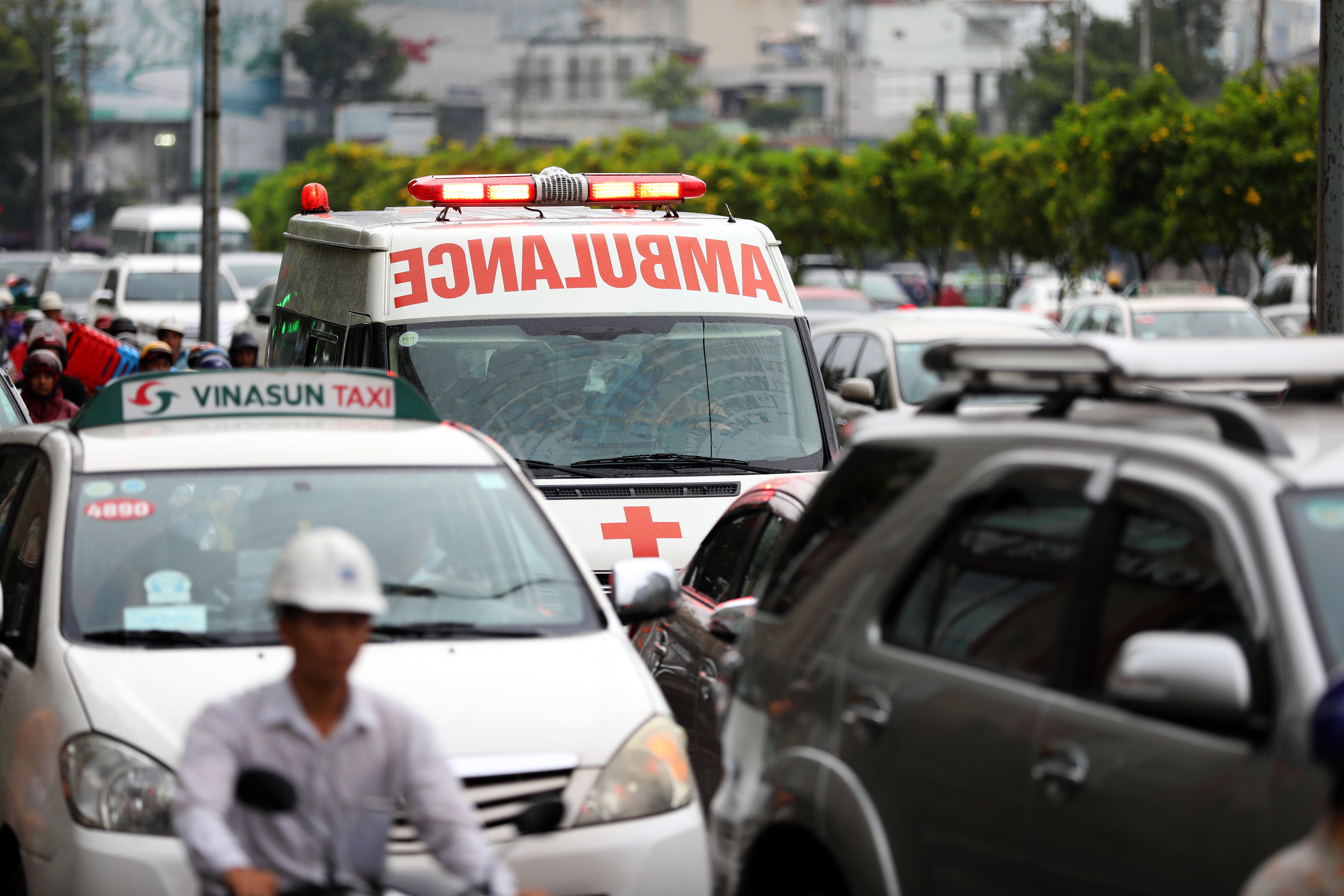 An ambulance battles traffic.