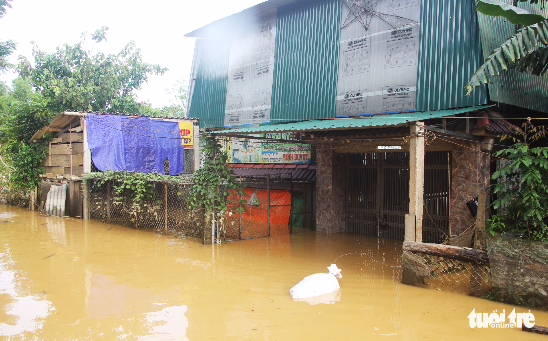 A house in Huong Son District, Ha Tinh Province, is isolated by floodwater.