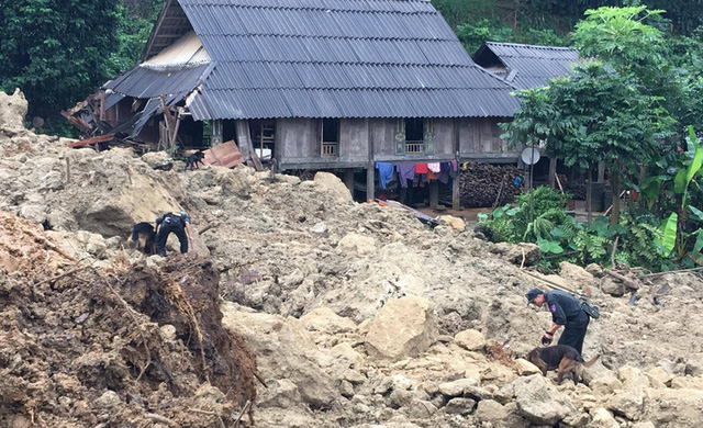 People search for victims of a landslide due to flood in Hoa Binh, northern Vietnam.