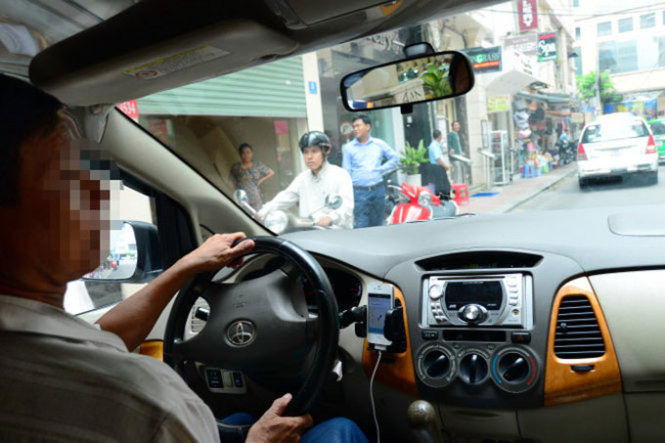 A Uber driver is seen in ho Chi Minh City.