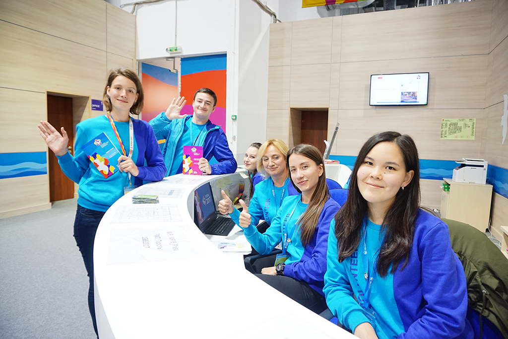 Young volunteers from Russia and several other countries pose at the event.