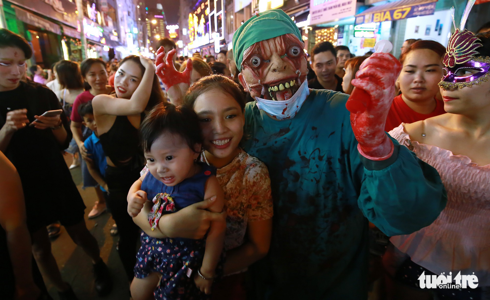 A man dressed up as a mad scientist poses with the crowd on Bui Vien Walking Street.