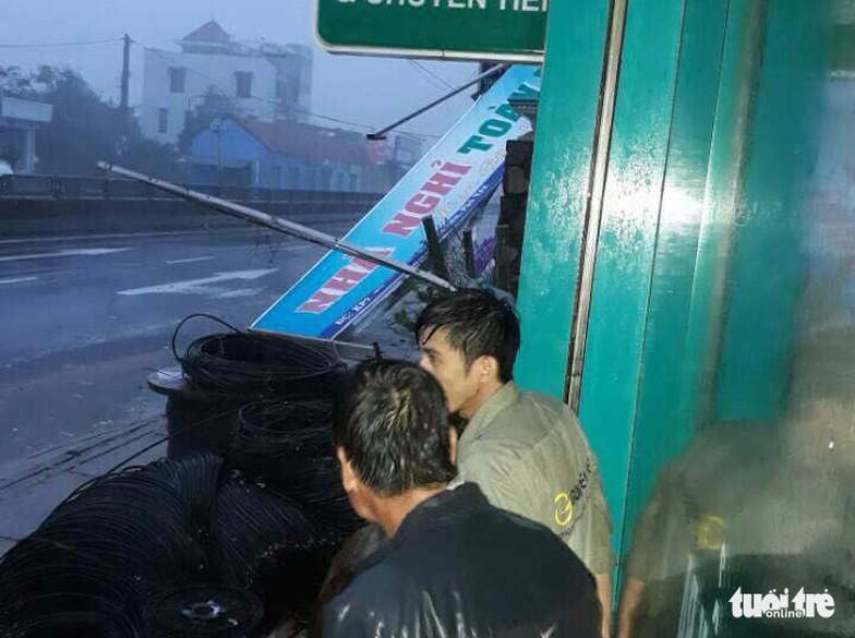 A guesthouse sign banner was destroyed by the storm.