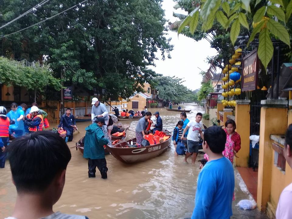 Local authorities (far left) assist with evacuations in Hoi An. Photo: Stivi Cooke