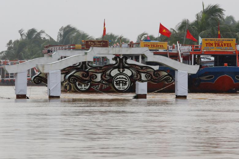 A bridge is seen on the overflowing Thu Bon river in Hoi An. Photo: Reuters