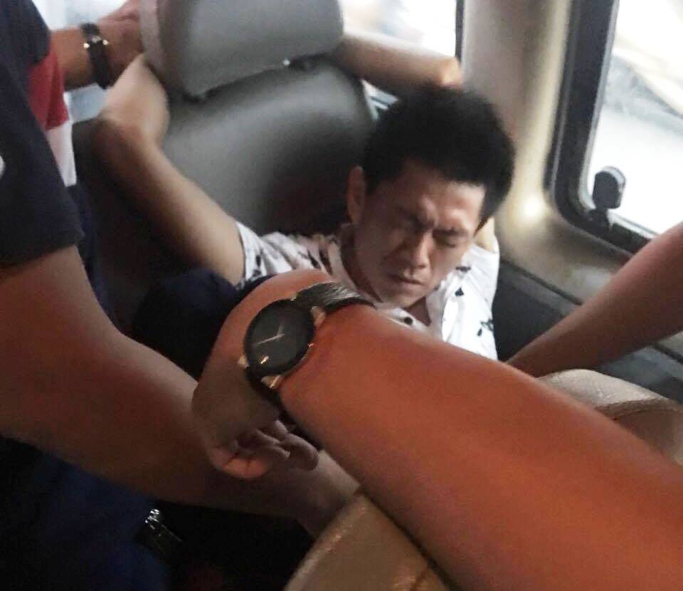 Nguyen Hong Phuc was arrested by plain-clothes officers while taking a passenger bus in southern Vinh Long Province. Photo: Ho Chi Minh City Police