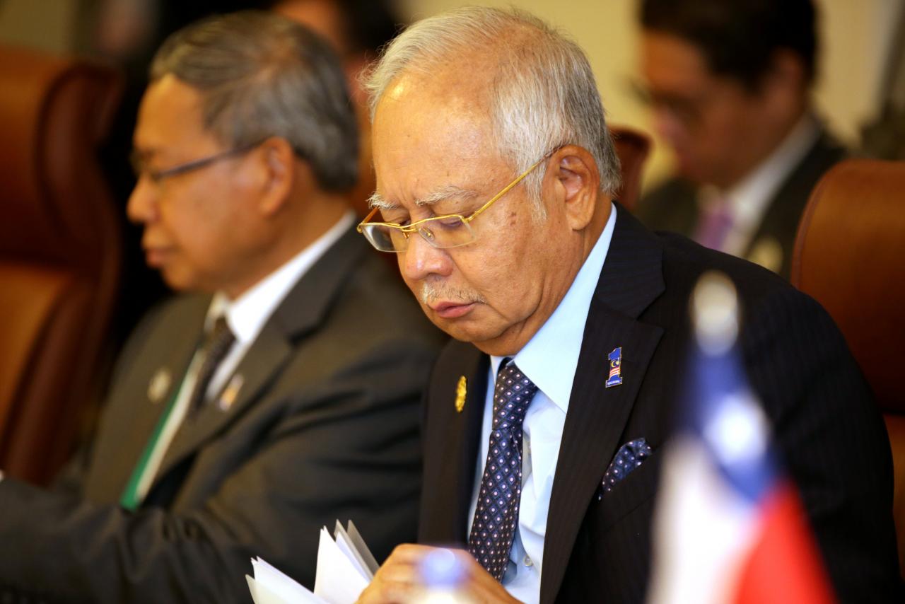 Malaysia's Prime Minister Najib Razak (R) is seen at the Trans-Pacific Partnership (TPP) meeting held on the sidelines of the APEC summit in Danang, Vietnam, November 10, 2017. Photo: Reuters