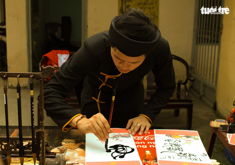 A calligraphy artist at work during