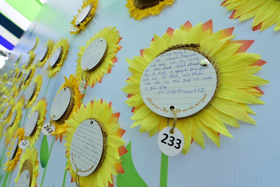 Wishes of children with cancer are written on the sunflower-shaped cards.