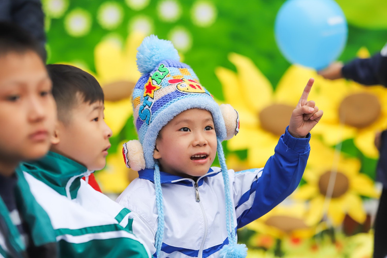A young boy with cancer enjoys the “Sunflower Festival” at the Hanoi Children’s Palace.