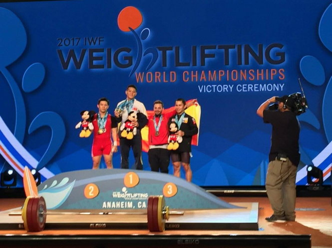 Vietnam's Thach Kim Tuan receives his gold medal at the 2017 IWF World Championships in the U.S., November 30, 2017.