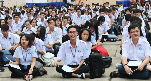 Ho Chi Minh City youths sit a test as part of a citywide competition to select ‘youth leaders’. Photo: Tuoi Tre