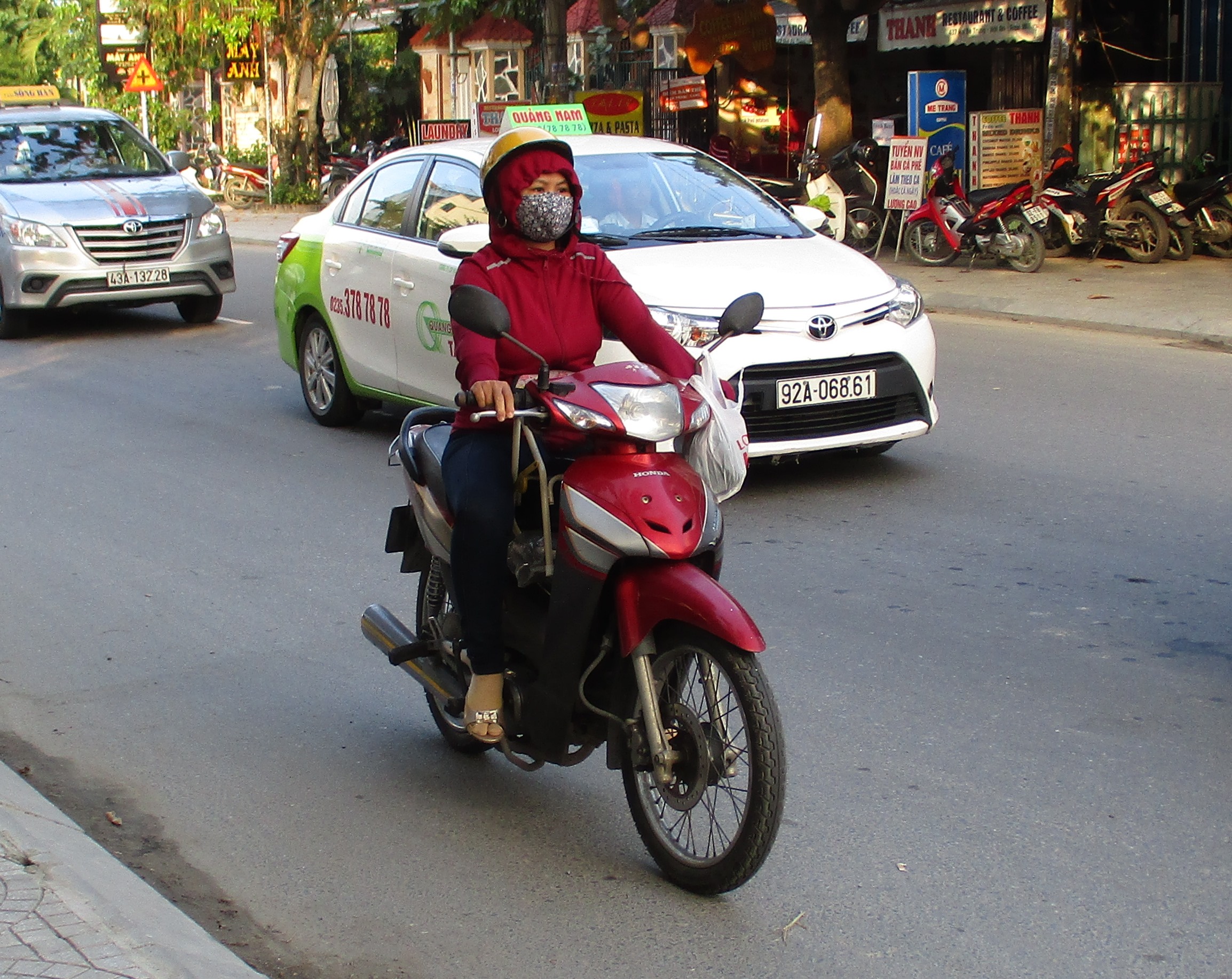 A Hoi An rider is rugged up against the cold. Photo: Stivi Cooke
