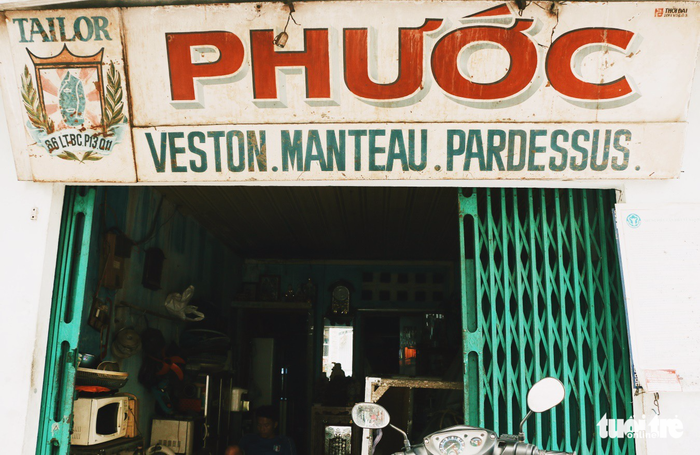 A century-old shop front sign of a tailor. Photo: NGHIA COCO