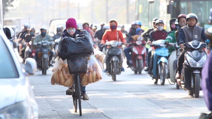 Hanoi residents travel on the morning of December 20, 2017.