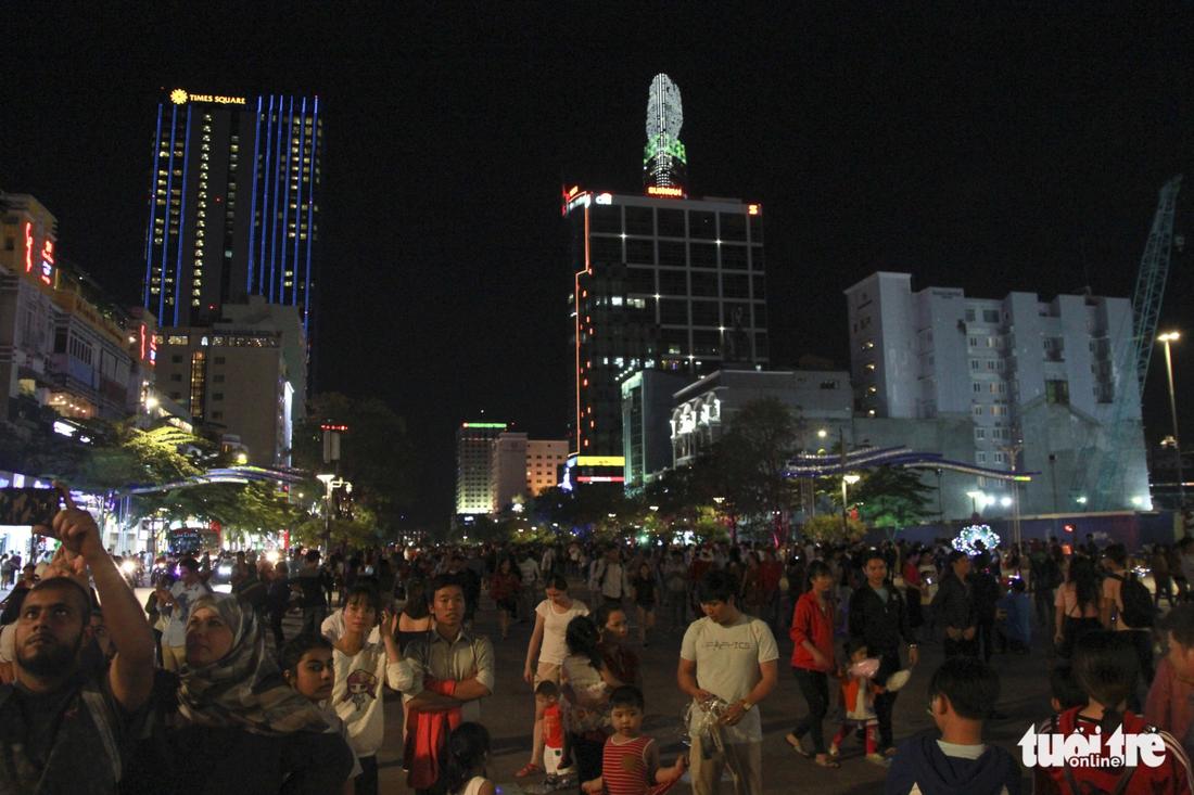 Residents enjoy Christmas Eve on Nguyen Hue Walking Street in downtown Ho Chi Minh City.