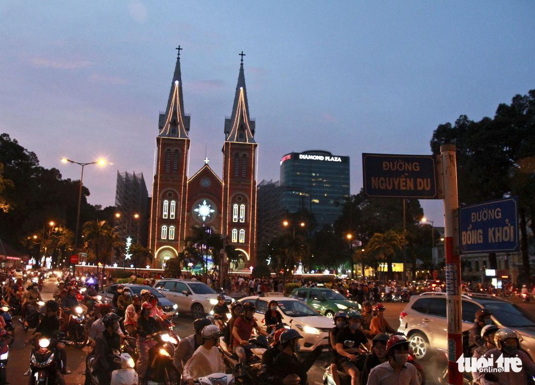 A large number of vehicles in front of the Notre-Dame Cathedral Basilica of Saigon