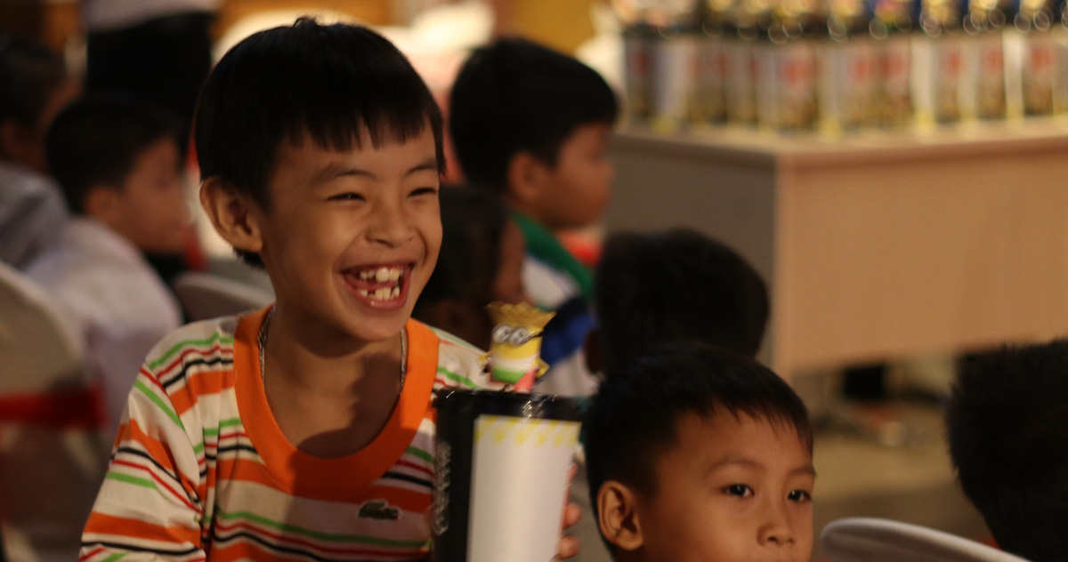 A kid smiles in an event in Ho Chi Minh City. Photo: Tuoi Tre