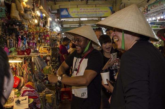 apl.de.ap (first, left) buys souvenirs at Ben Thanh Market, one of Ho Chi Minh City's icons, on December 30, 2017. Photo: Amberstone