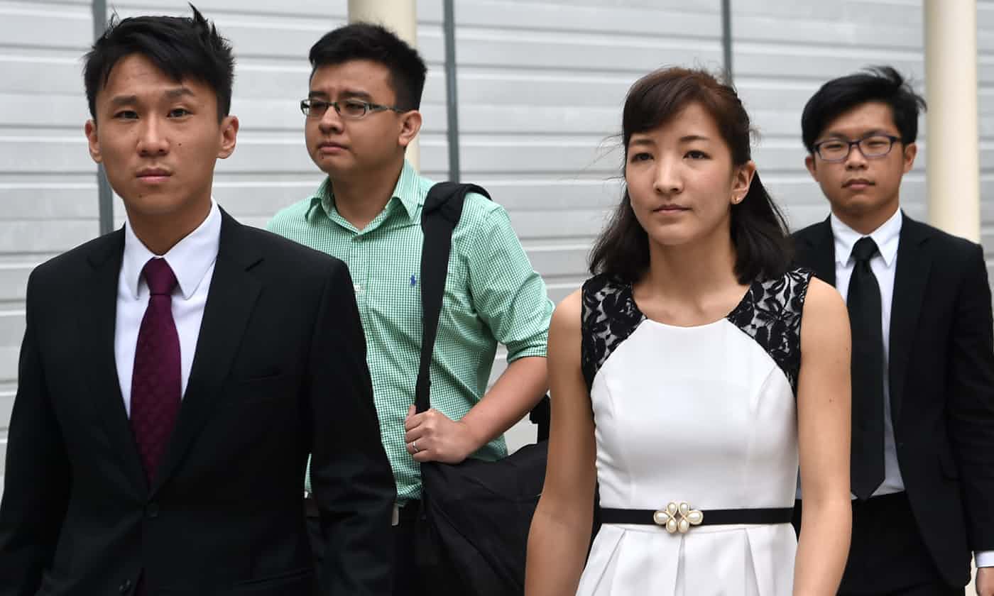 Lawyer Choo Zheng Xi (front left) leaves a court in Singapore on March 24, 2016. Photo: AFP