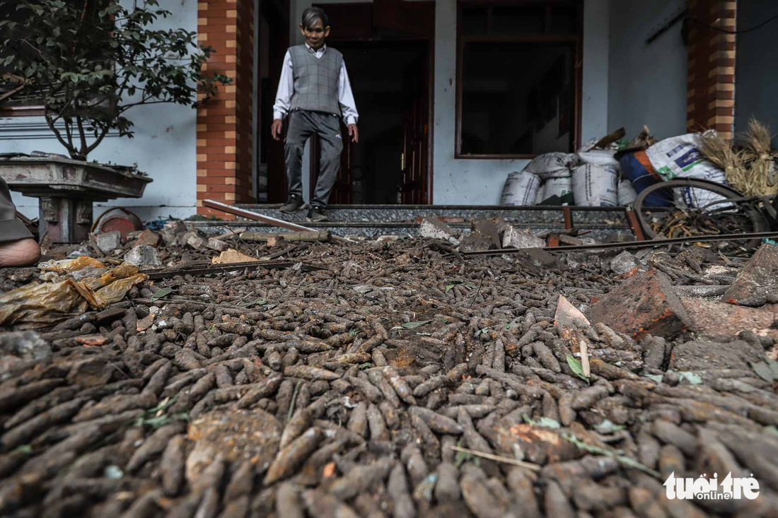 Bullets shells fill the yard of a residence following the blast. Photo: Tuoi Tre