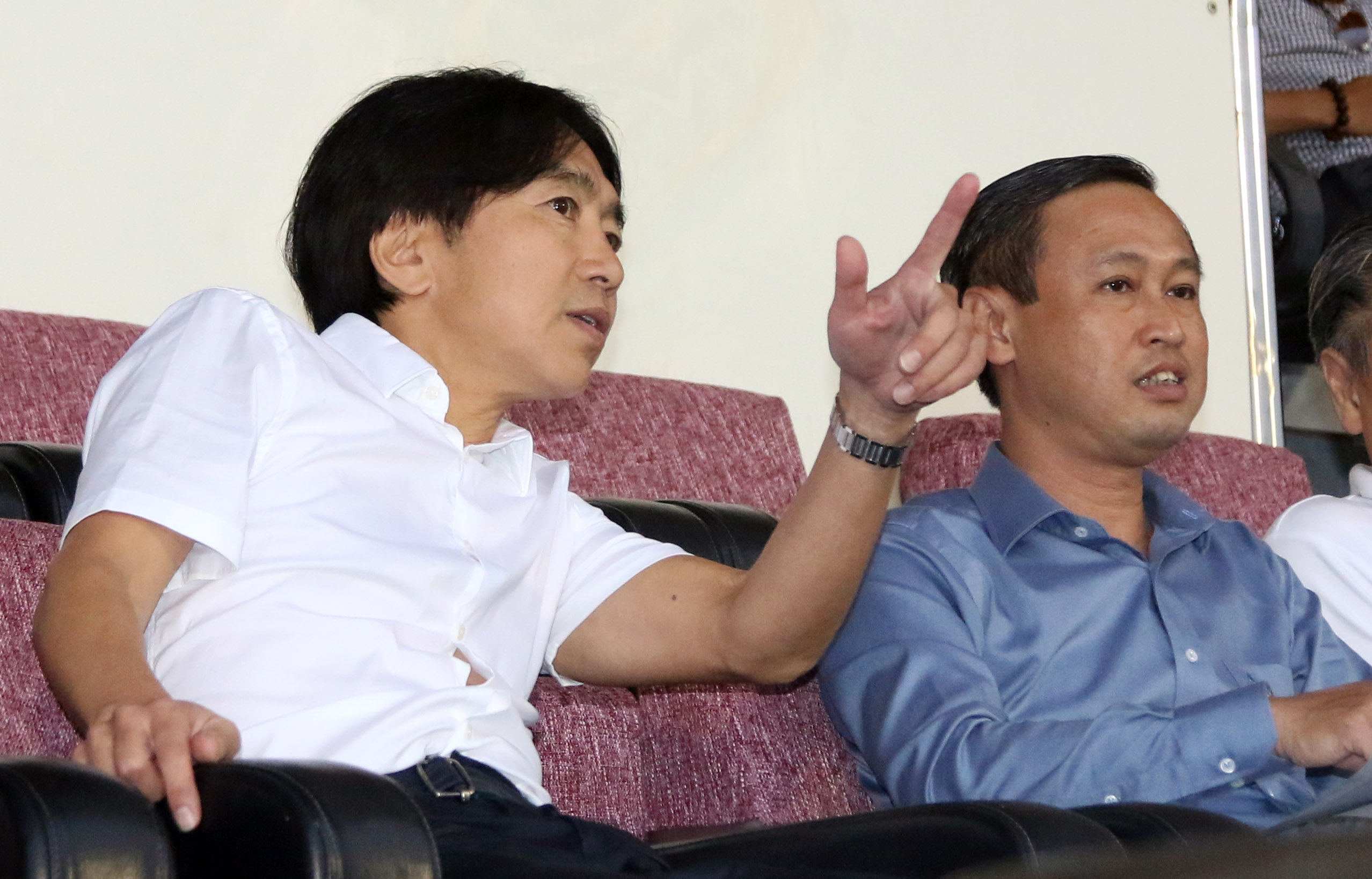 Former Vietnam's head coach Toshiya Miura (left) watches a match of Ho Chi Minh City FC.