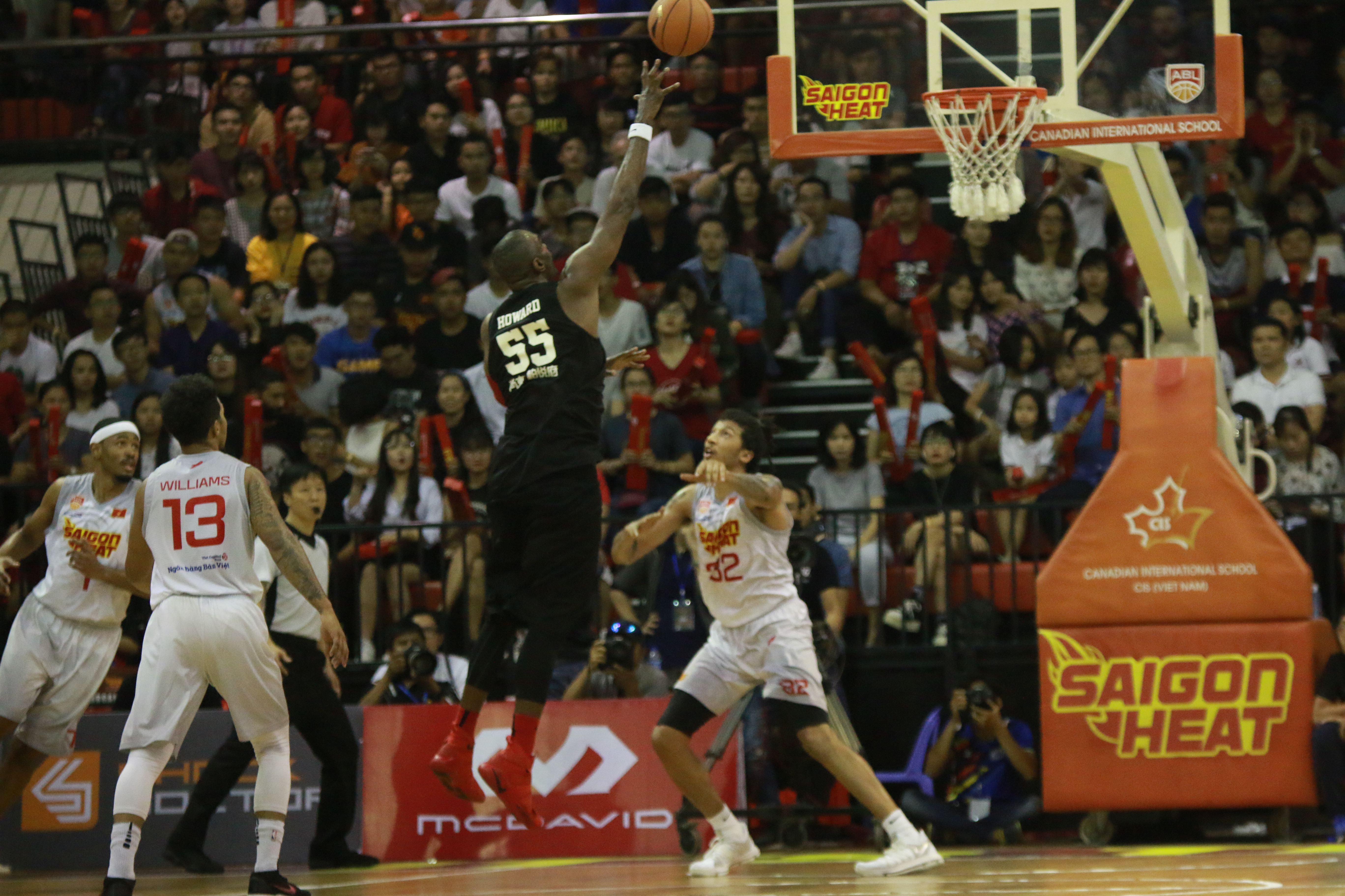 Chong Son Kung Fu's Justin Howard takes a shot surrounded by Saigon Heat defenders during a clash in Ho Chi Minh City in the ASEAN Basketball League, January 13, 2018. Photo: Pham Long