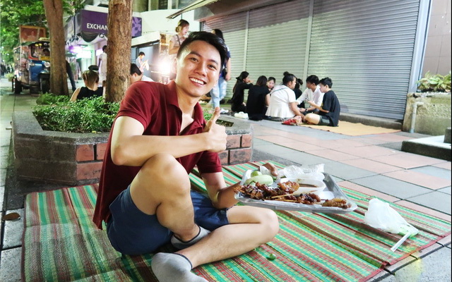 Hoai Phuong tries local foods in Thailand in this supplied photo.