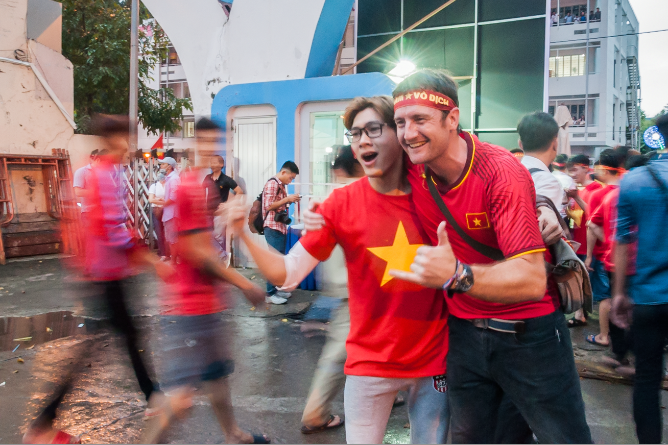 Fans spill out onto the street outside the HCMC Youth Cultural House after Vietnam’s U23 AFC Championship semi-final against Qatar on January 23, 2018. Photo: Vu Ha Kim Vy