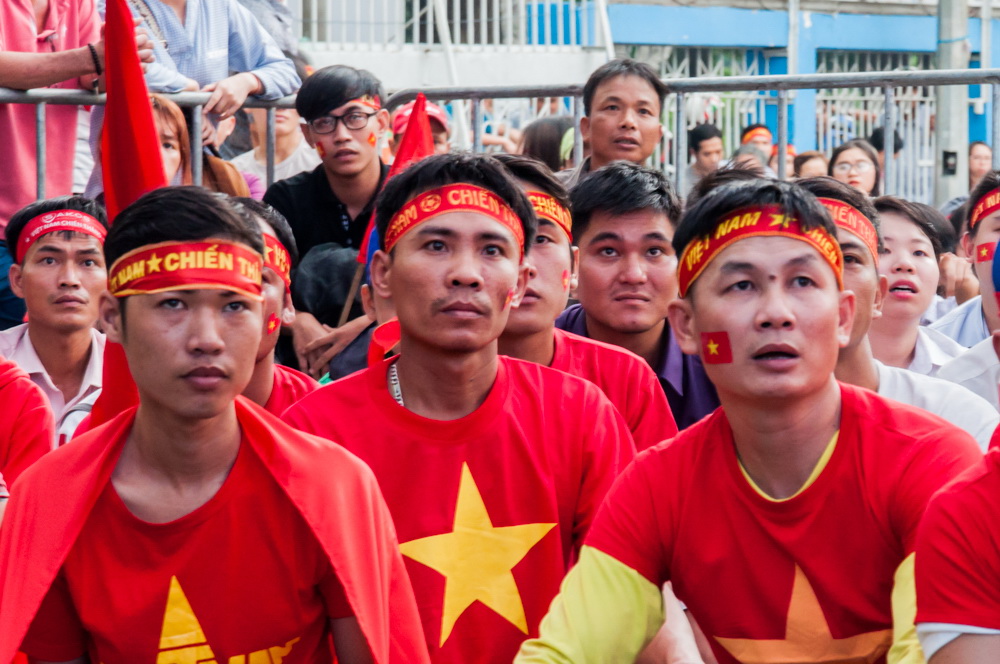 Fans are glued to the action at the Ho Chi Minh City Youth Cultural House during Vietnam’s U23 AFC Championship semi-final against Qatar on January 23, 2018. Photo: Vu Ha Kim Vy