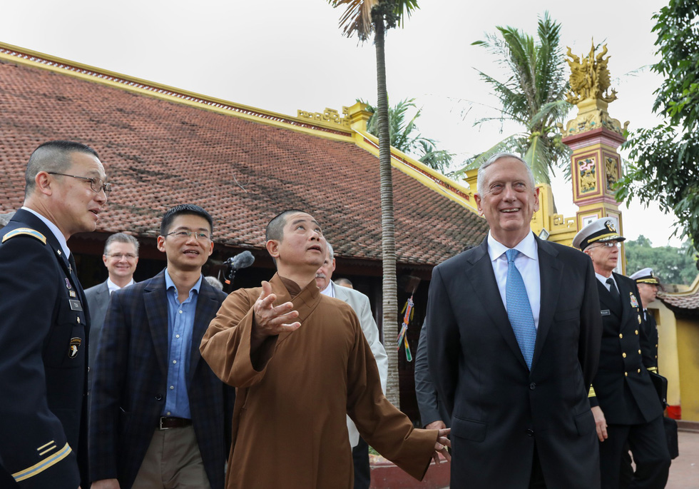 James Mattis talks with a monk at the pagoda.