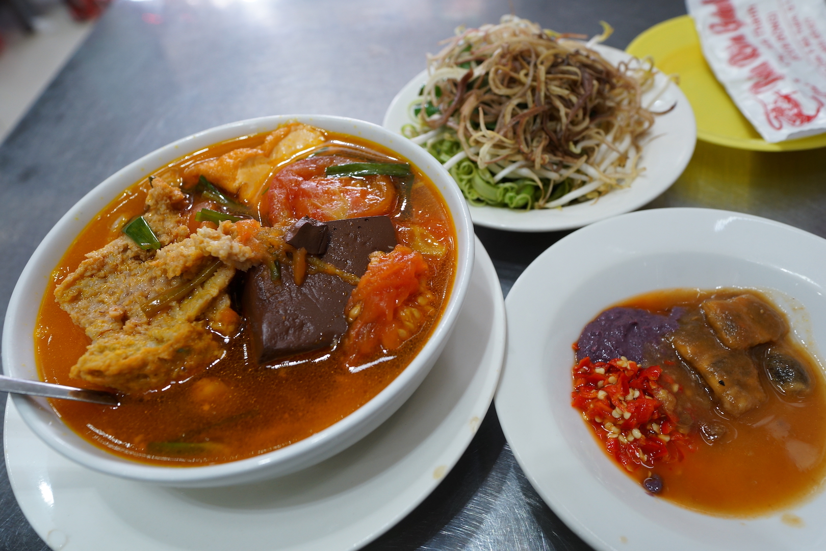 A serving of bun rieu at Bun Rieu Ganh, with shrimp paste, tamarind and chilli in a separate plate, taken on January 23, 2018. Photo: Tien Bui