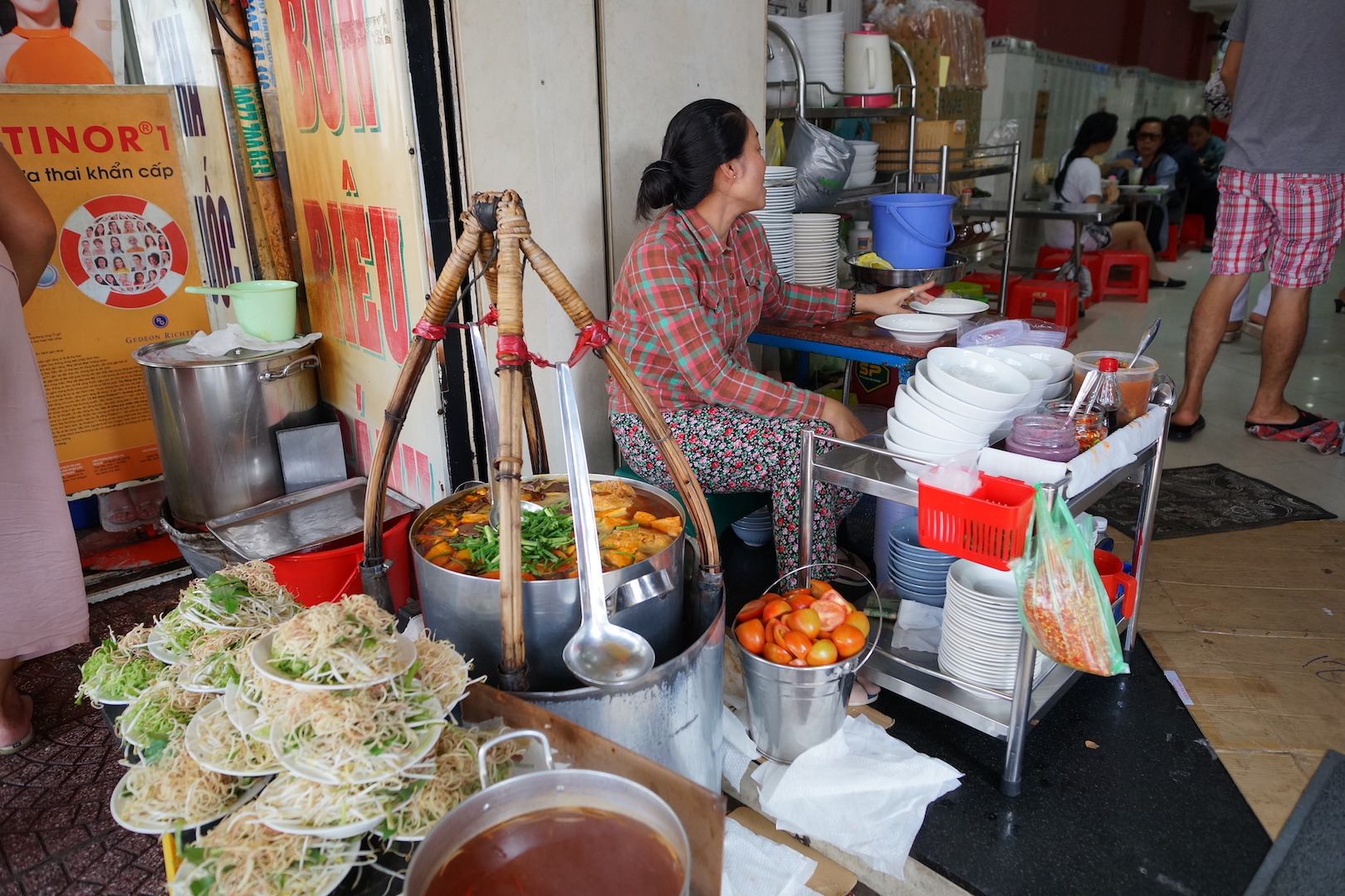 The chef at Bun Rieu Ganh by her colorful workplace, taken on January 23, 2018. Photo: Tien Bui