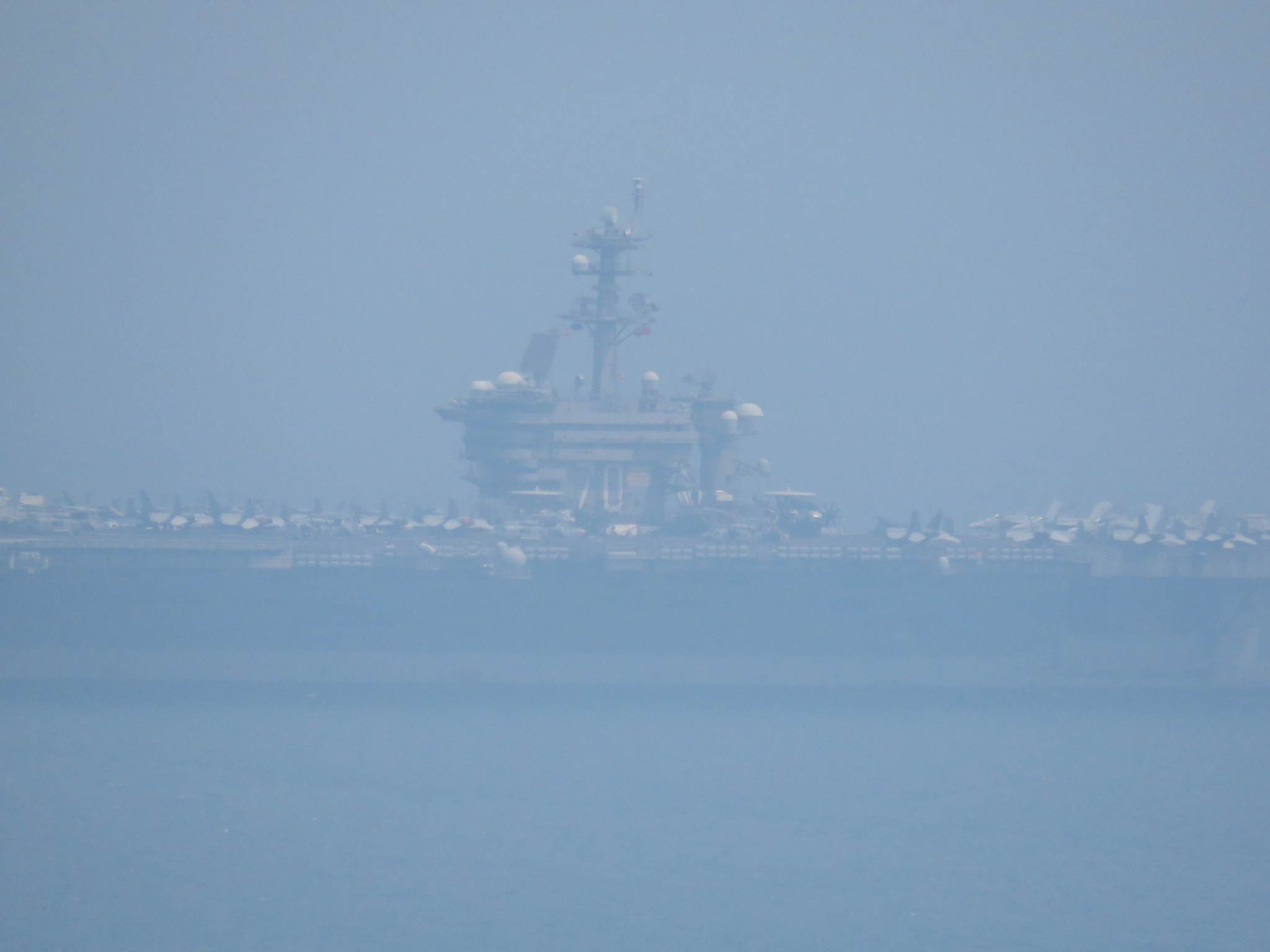 The USS Carl Vinson is seen in foggy weather off Da Nang City, central Vietnam, on March 5, 2018. Photo: Tuoi Tre