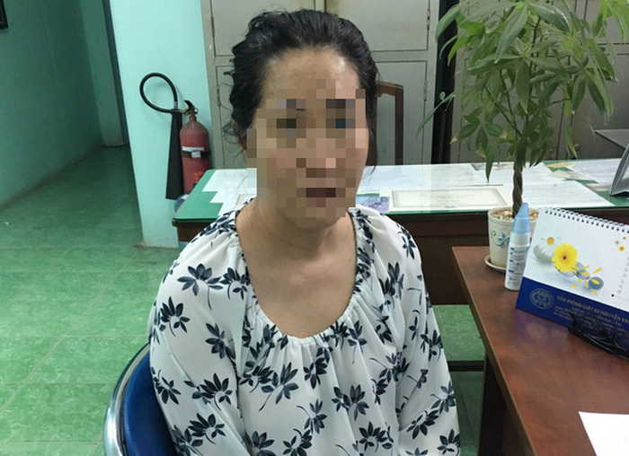 Truong Huong is held at the police station in Ho Chi Minh City in the photo supplied by officers.