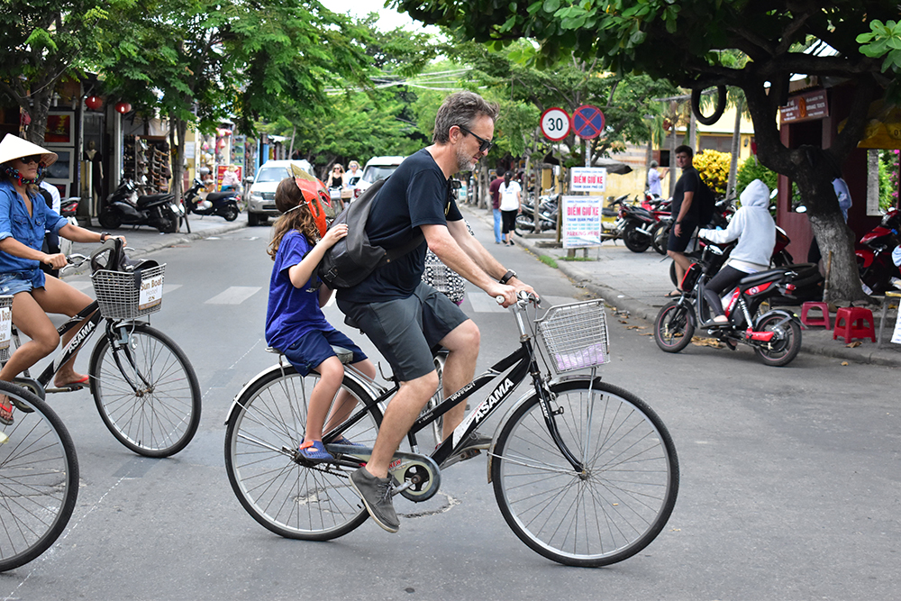 Foreign tourists ride bicycles in Hoi An, located in central Vietnam. Photo: Tuoi Tre