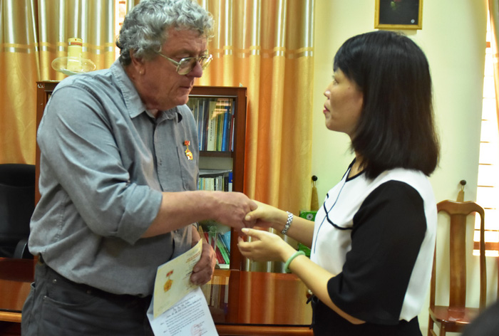 Mike Boehm receives a medal from the Women’s Union in Quang Ngai Province, Vietnam, for his work in assisting local women.