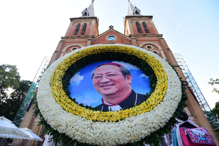 A portrait of late Archbishop Paul Bui Van Doc is seen outside the Saigon Notre-Dame Basilica in Ho Chi Minh City where his funeral is held on March 16, 2018. Photo: Tuoi Tre