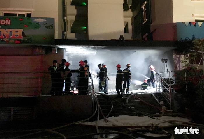 Firefighters are seen at the scene. Photo: Tuoi Tre