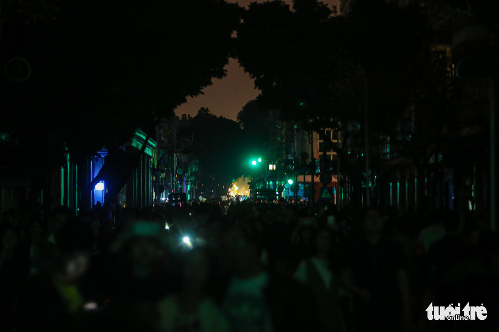 Lights are switched off along a street in Hanoi.